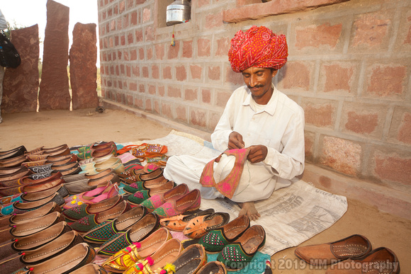 Shoemaker with his wares